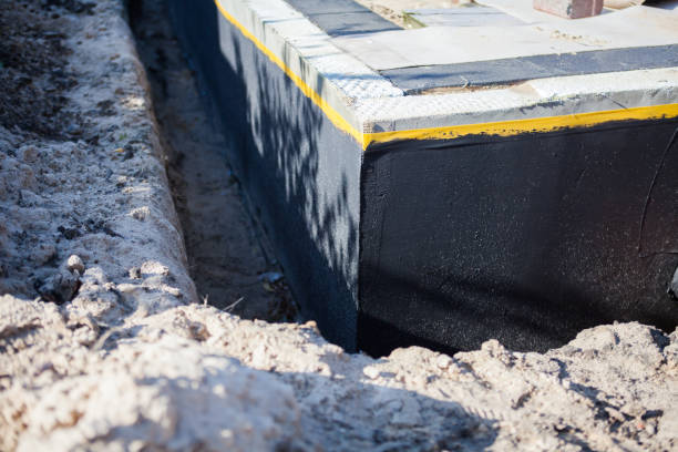 Professional Waterproofing technician working in Byron Center, MI